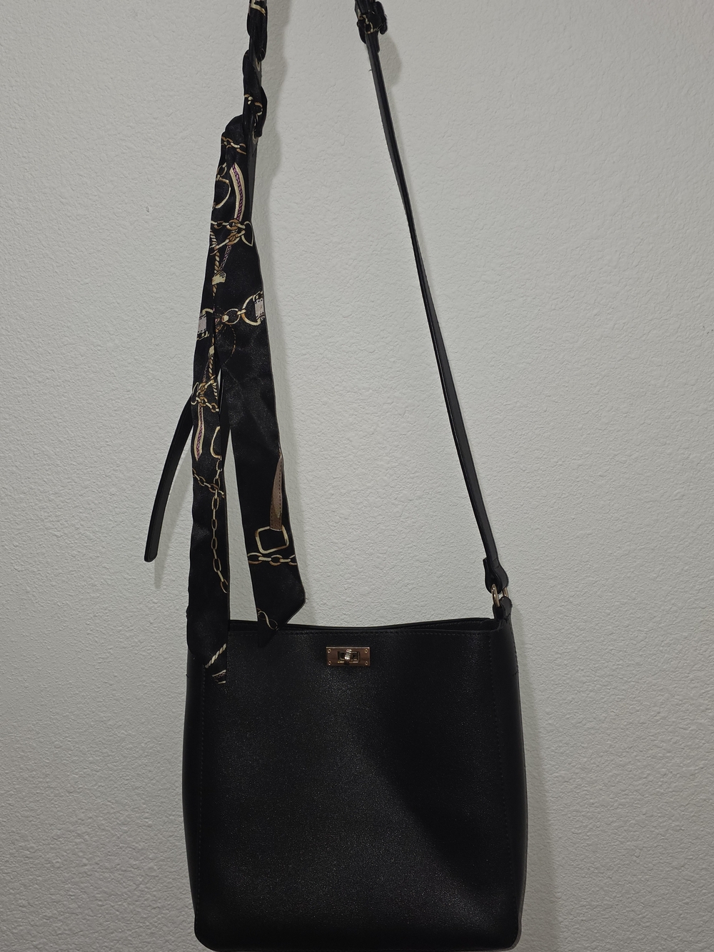 Classic Black Crossbody Bag with Patterned Scarf Accent